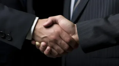 Close-up business handshake symbolizing Anthropic's public benefit fund commitment