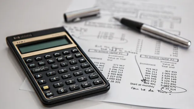Calculator and pen resting on financial documents with calculations, representing budgeting for AI tool pricing