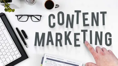 Overhead photo of a writer's desk with a laptop, coffee cup, glasses and large CONTENT MARKETING letters, featured image for this Jasper AI review