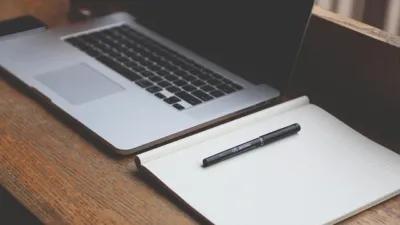 Laptop running Jan offline AI chat on a business desk