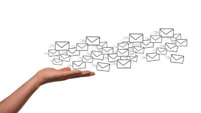 Hand with hand-drawn envelope icons floating above it, symbolizing email marketing and newsletter delivery