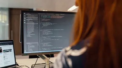 Developer working with code on a computer screen, illustrating the OpenHands AI coding agent tutorial