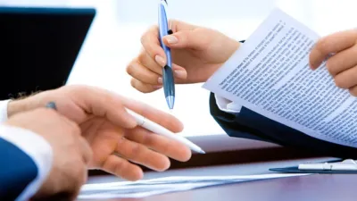 Business documents on a desk used for AnythingLLM private AI chatbot