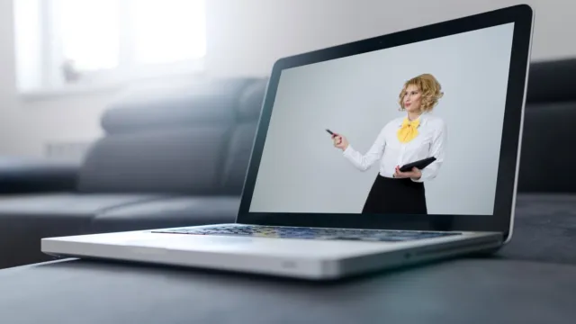 Laptop showing a businesswoman giving an online presentation, representing an AI meeting assistant