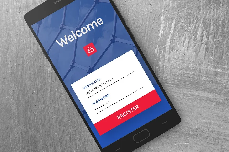 Hand holding a key over a laptop with a login form on screen — 1Password for Agents lets AI agents sign in without seeing passwords