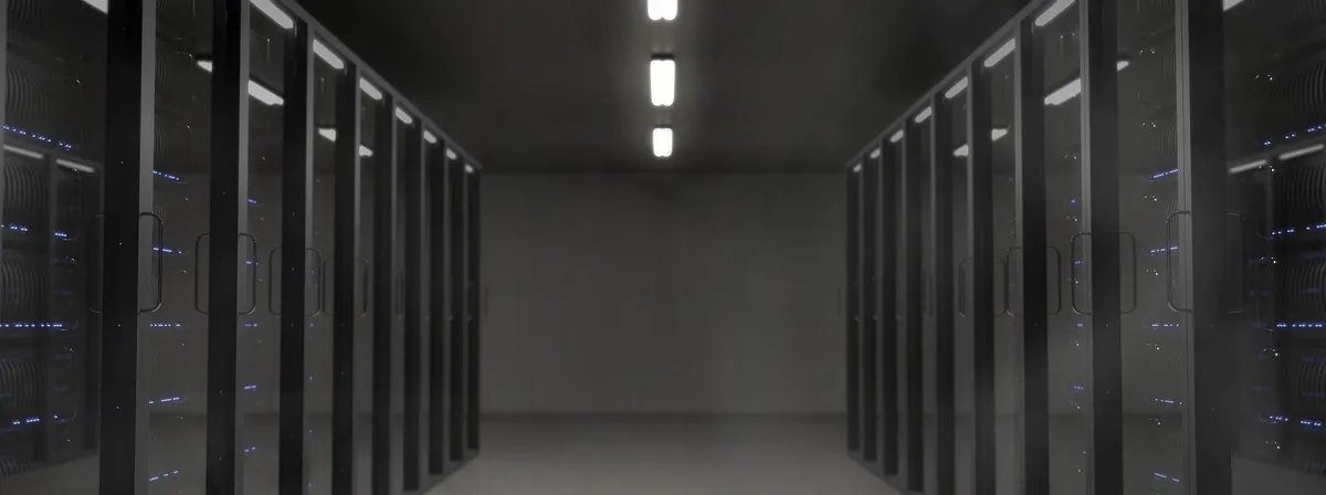 Symmetrical rows of server racks in a dark data center server room, illustrating OpenAI models on Google Cloud