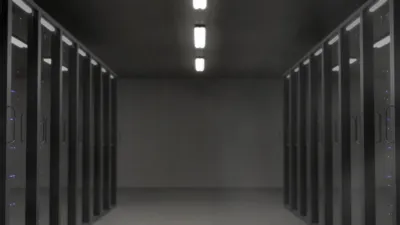 Rows of server racks inside a modern data center — Microsoft exited its Nscale UK AI data center deal after grid power delays