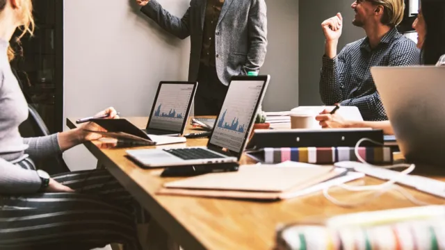 Small business owner using a laptop with AI tools